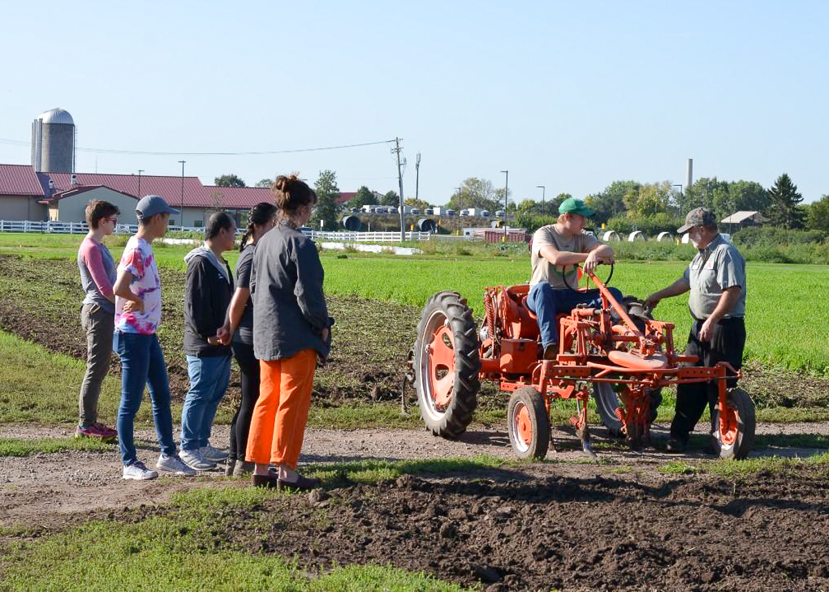 Students are being trained on a tractor 